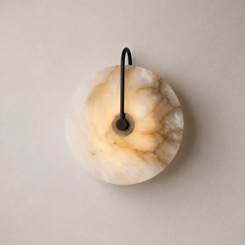 The Marquise marble wall sconce, a decorative wall light with a disc shade