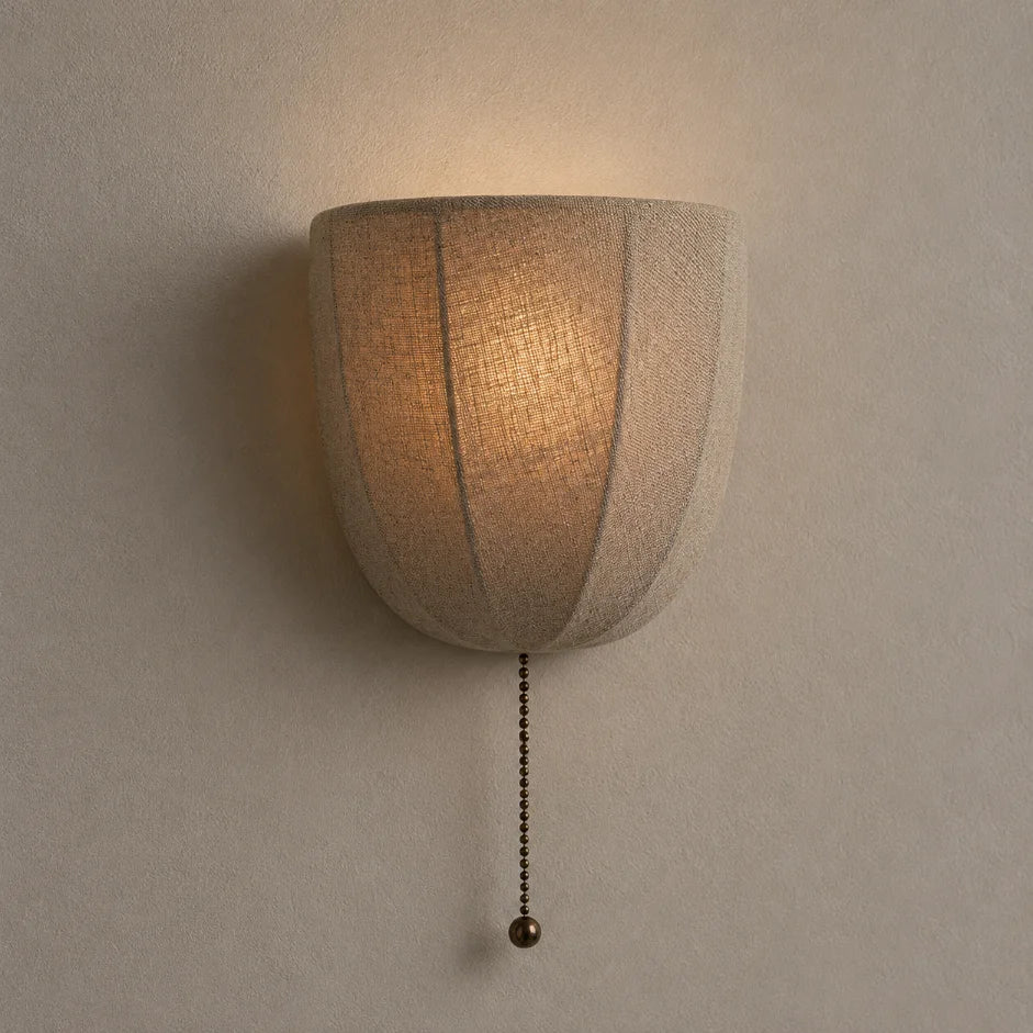 The Veil linen fabric wall sconce with antiqued brass detail
