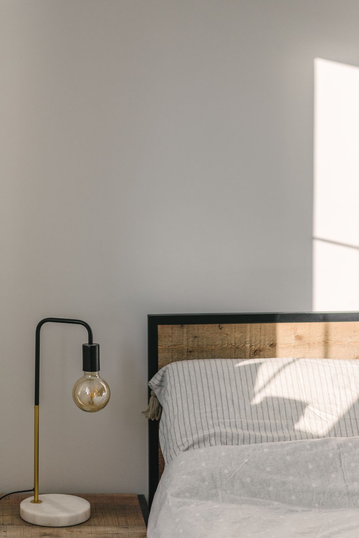Bedroom wall with lamp beside bed - plug-in vs hardwired wall lights