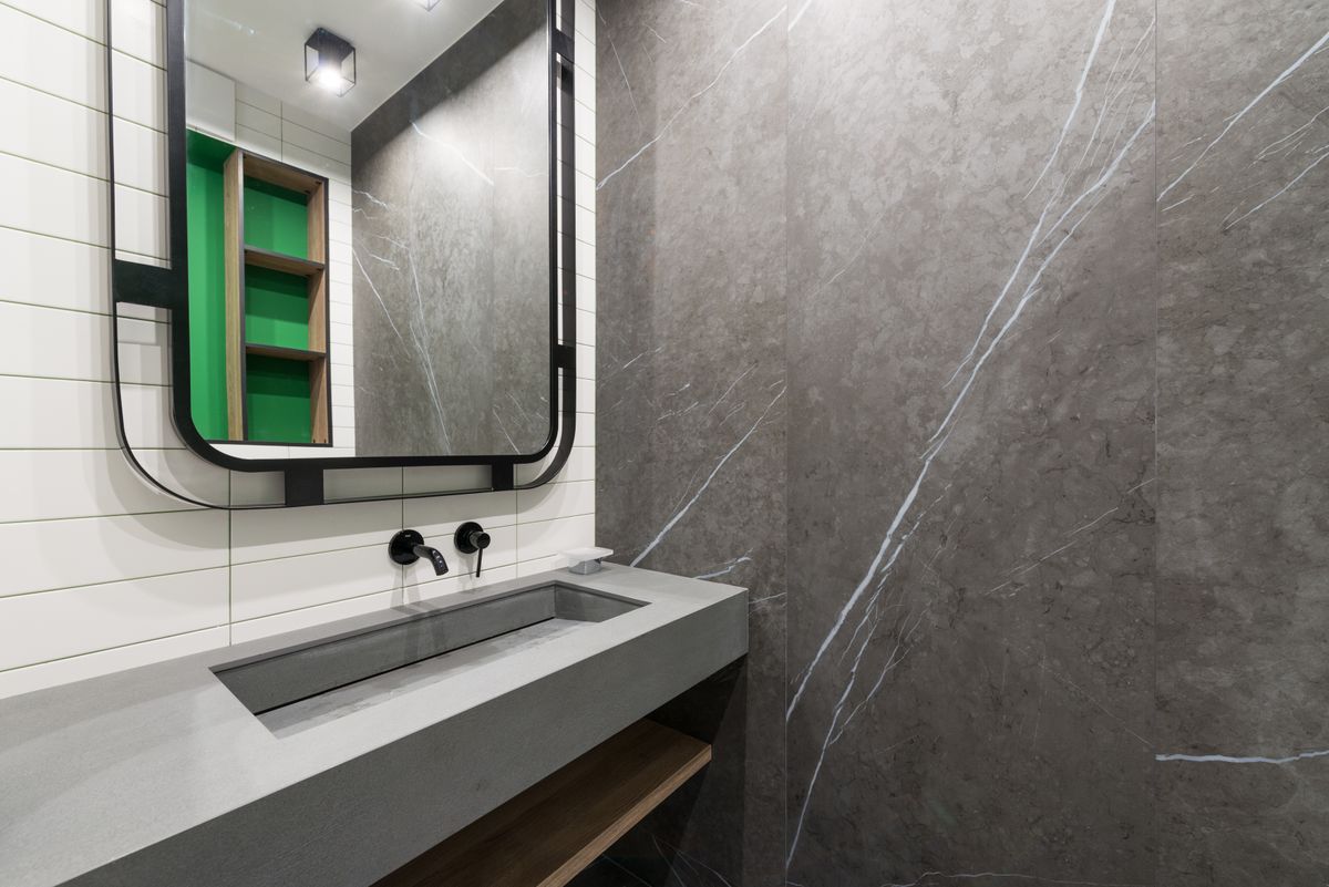 Modern bathroom vanity with mirror and wall lighting