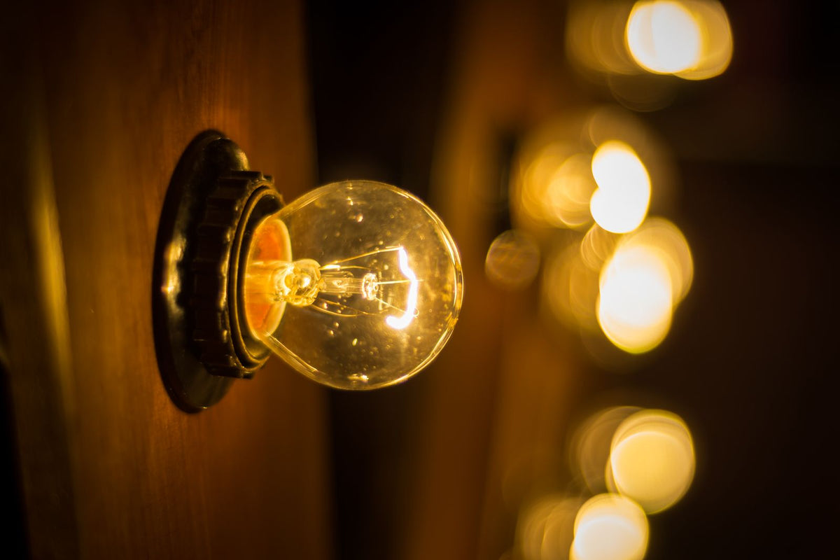 Close-up of a glowing Edison light bulb - bulb fitting types explained