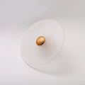 The Orbis wall sconce in brass finish, unlit