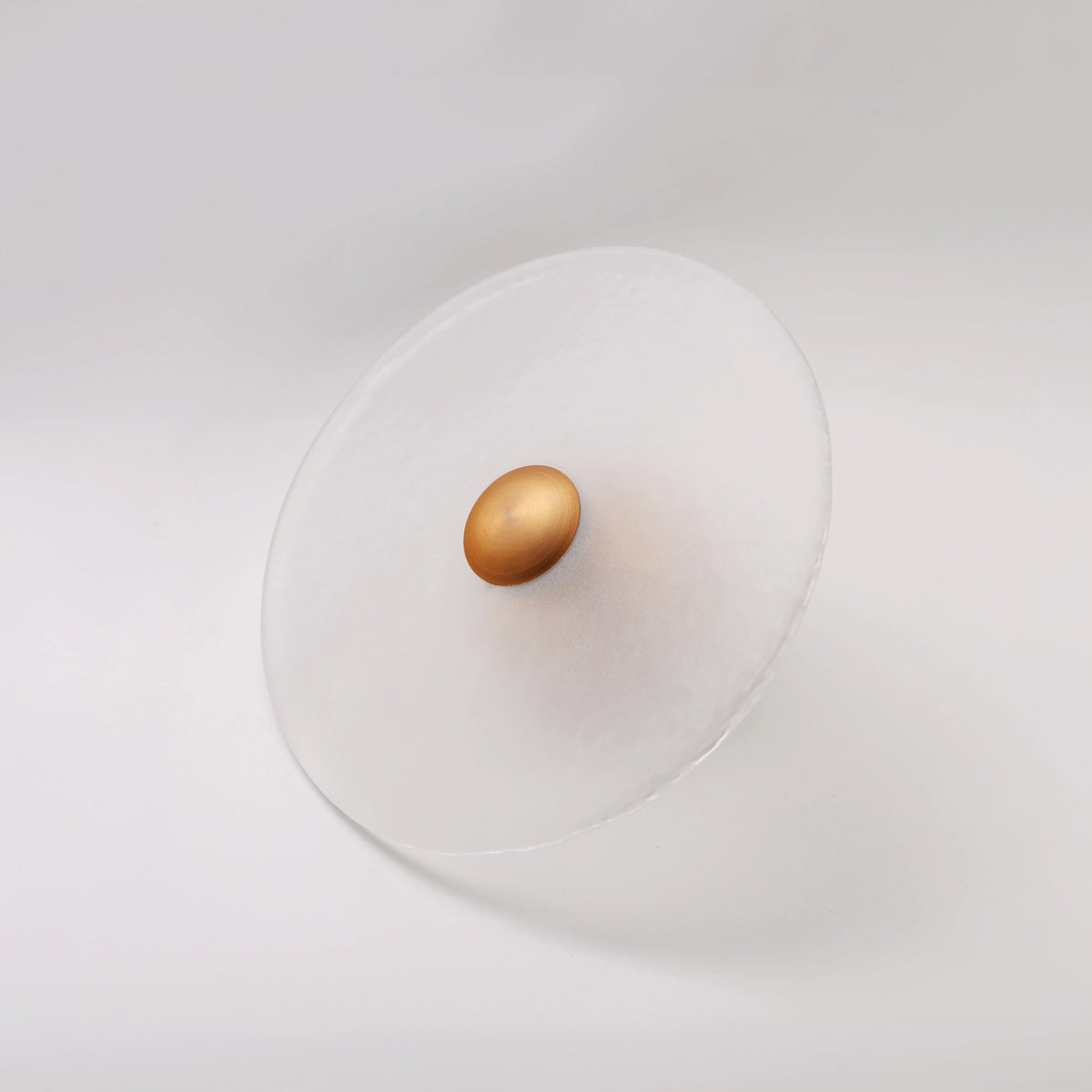 The Orbis wall sconce in brass finish, unlit