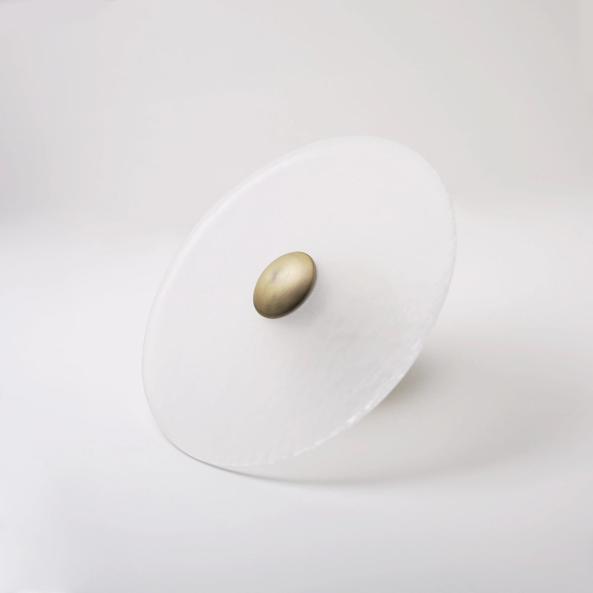 The Orbis wall sconce in bronze finish, unlit
