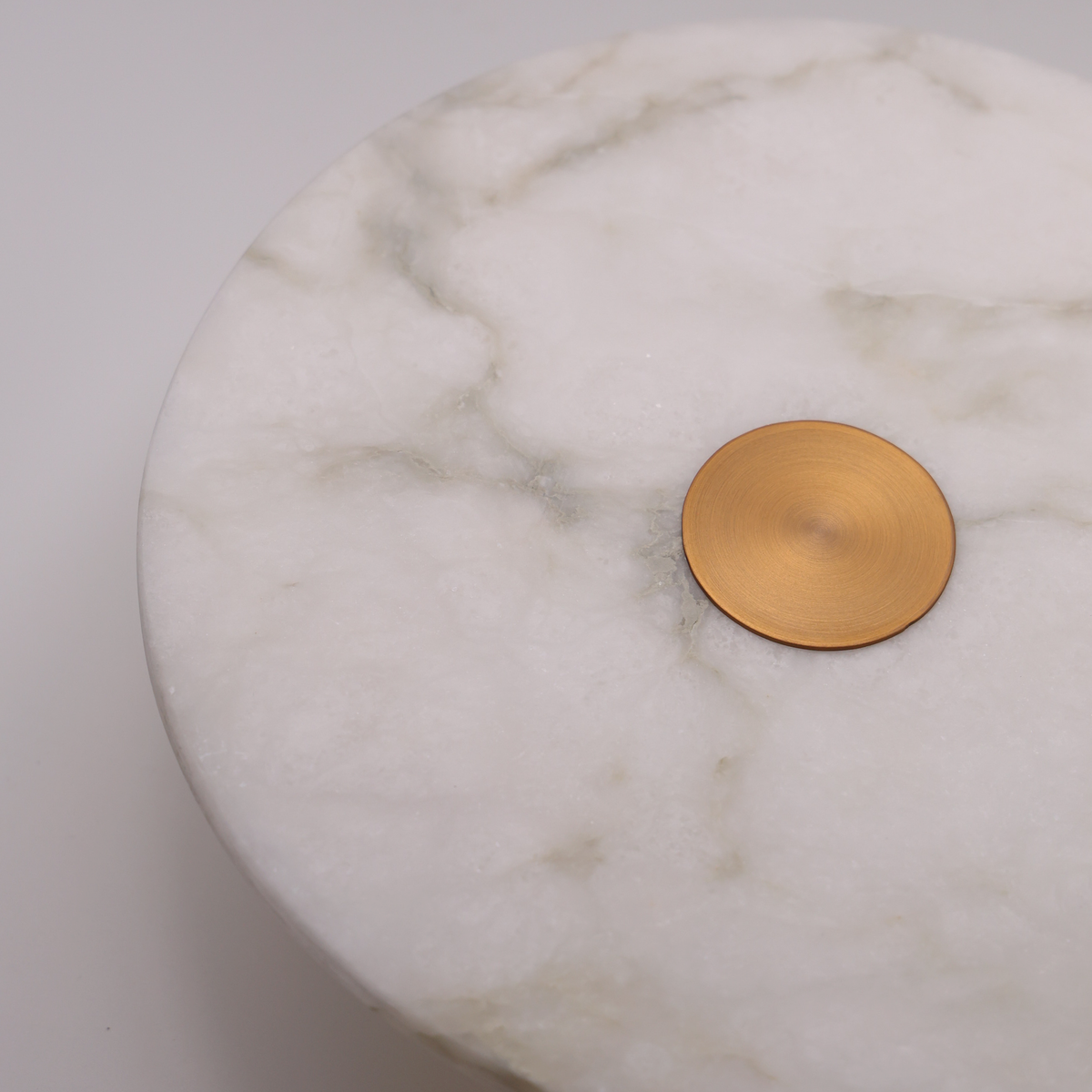 The Alba alabaster disc wall light close-up detail
