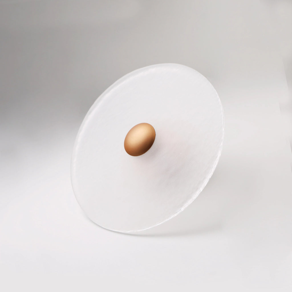 The Orbis wall sconce in copper finish, unlit