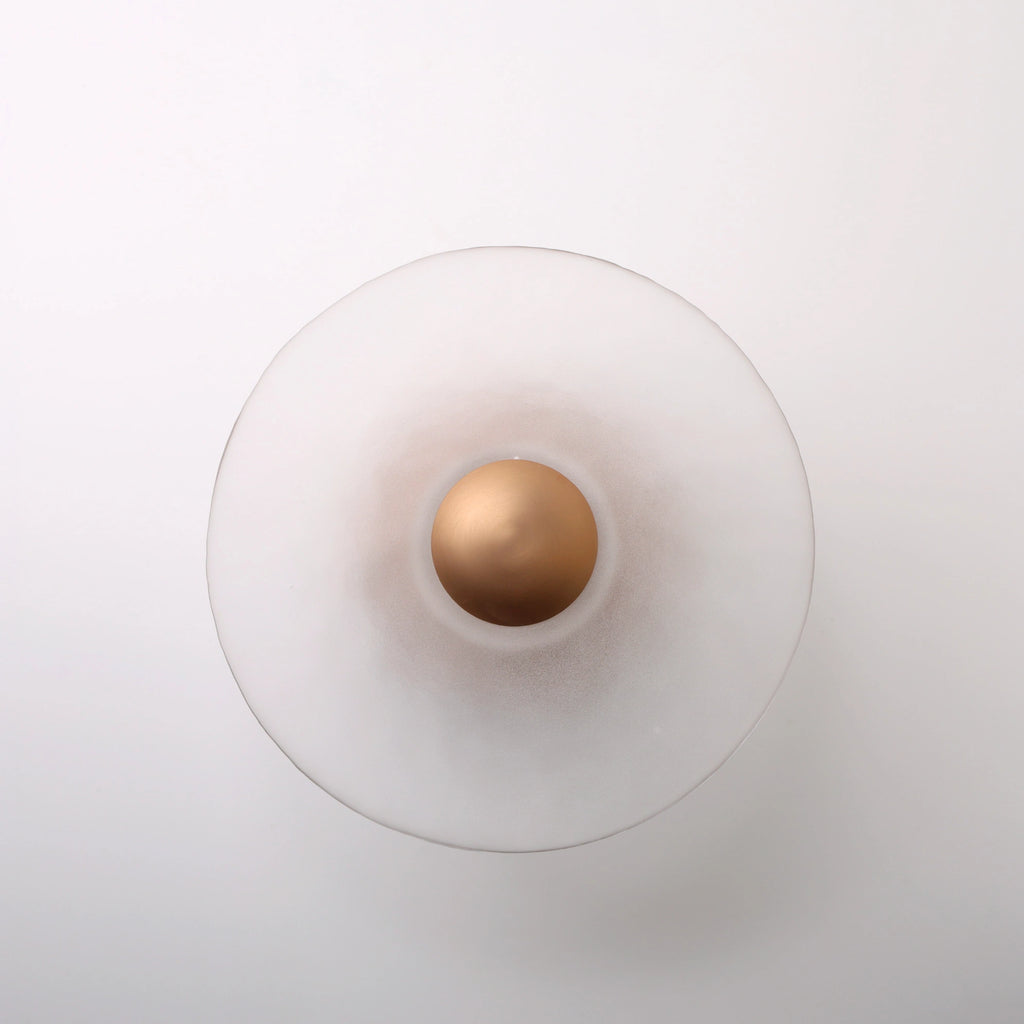 The Orbis copper wall sconce detail view