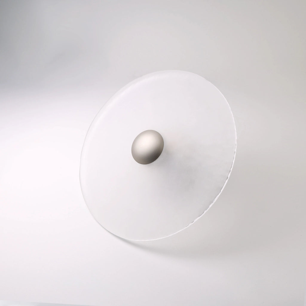 The Orbis wall sconce in nickel finish, unlit