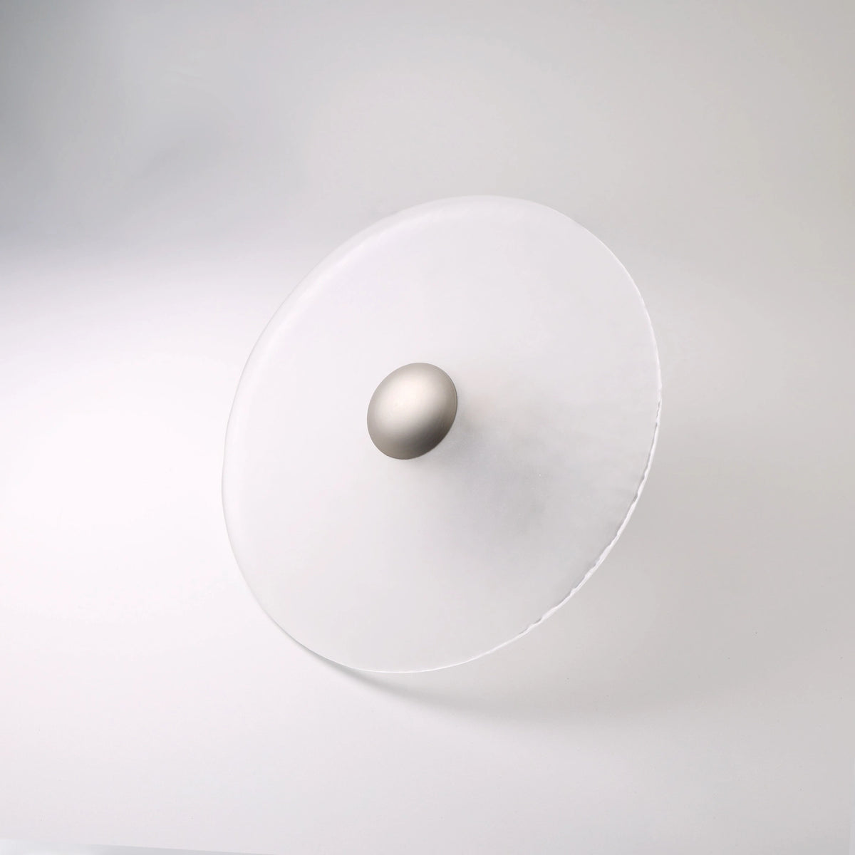 The Orbis wall sconce in nickel finish, unlit