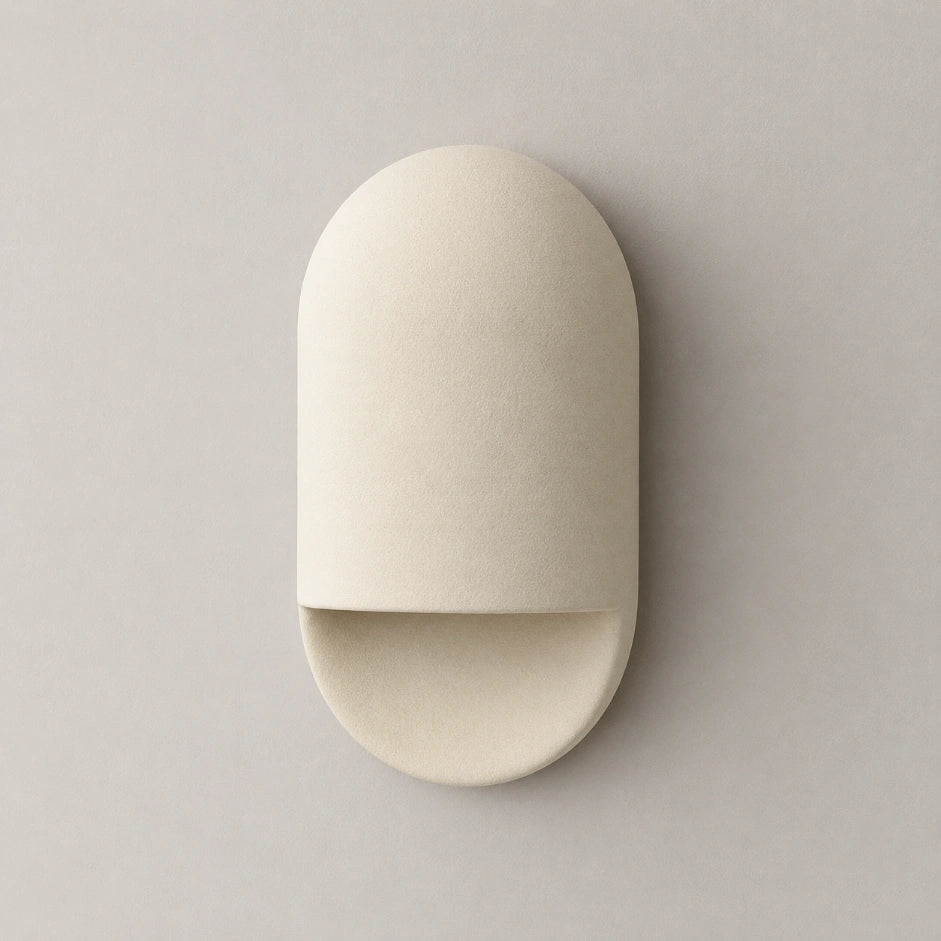 The Capsule minimal ceramic wall sconce, front view