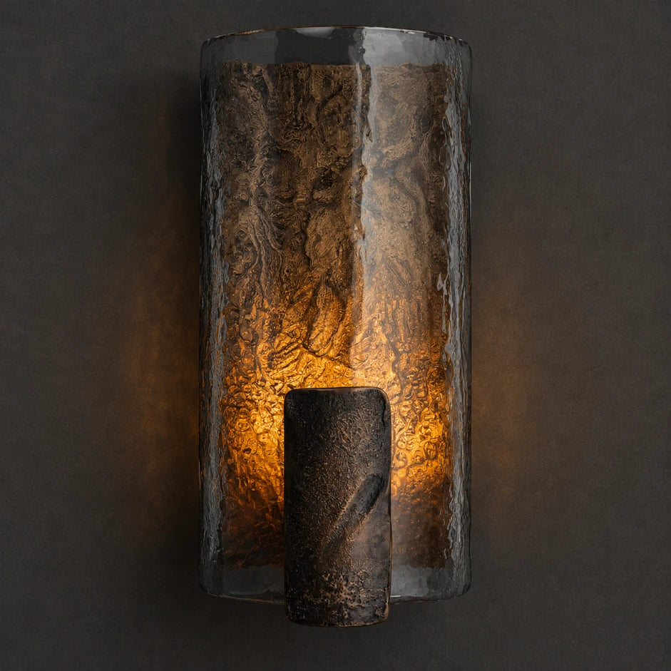 The Remy retro copper glass wall sconce lit with warm glow