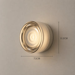 The Orb outdoor LED wall sconce glowing on exterior wall
