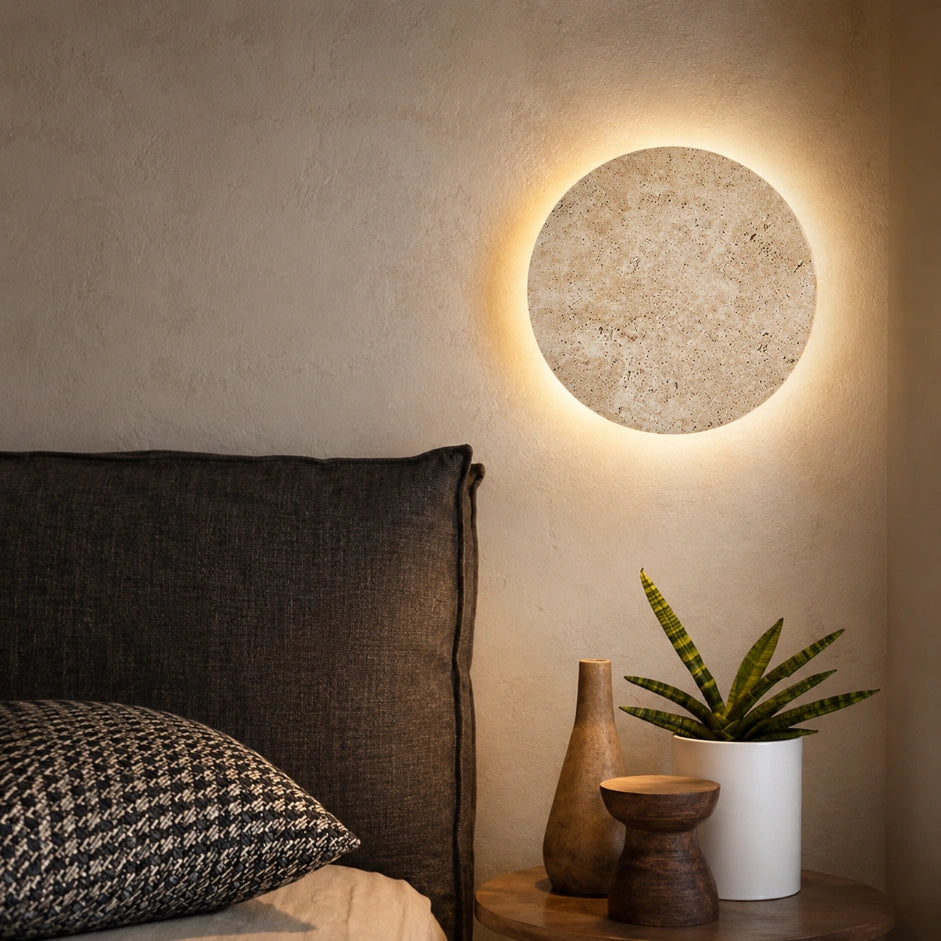 The Terra round stone sconce detail view