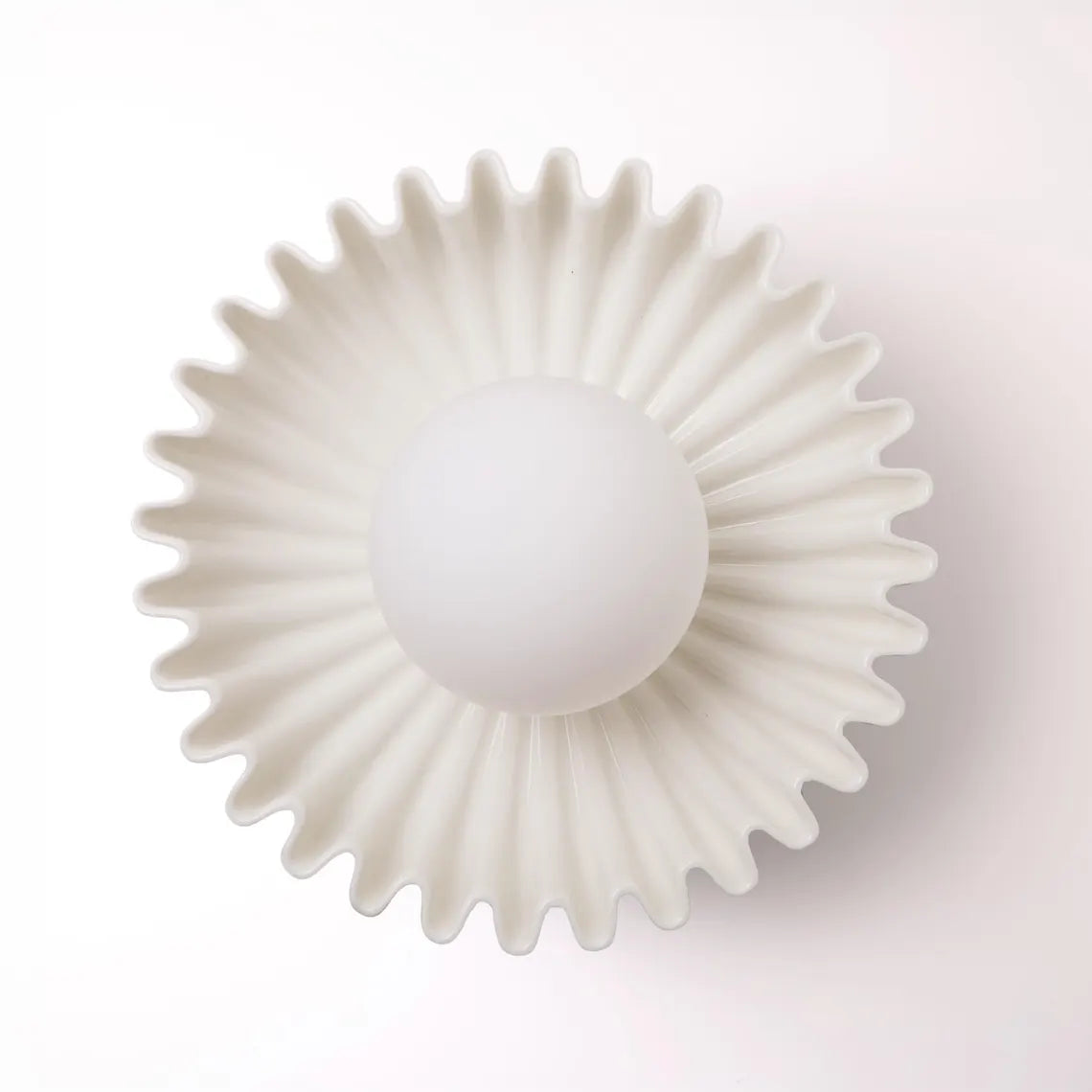 The Solara white ceramic wall sconce, front view
