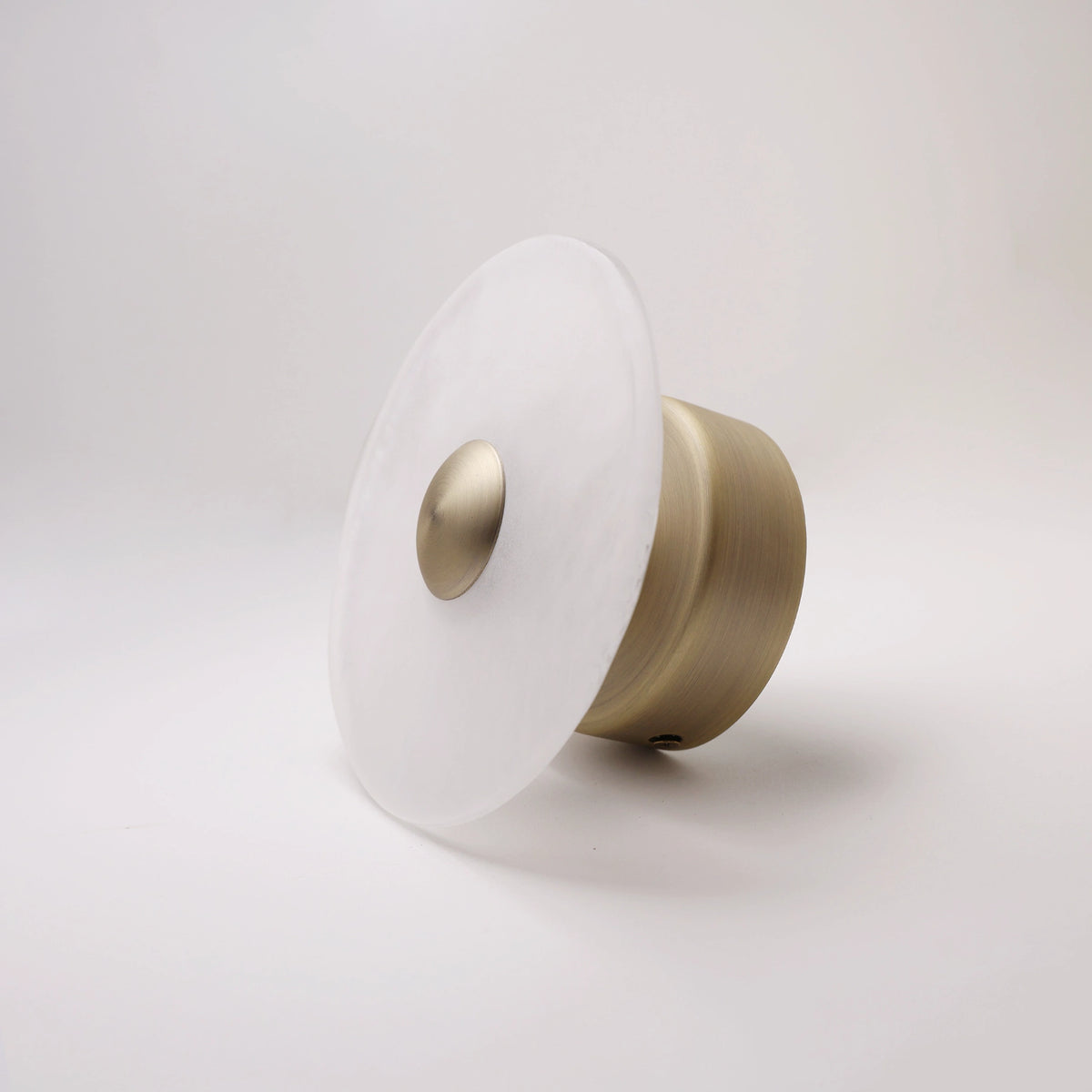 The Orbis frosted glass wall sconce with bronze dome