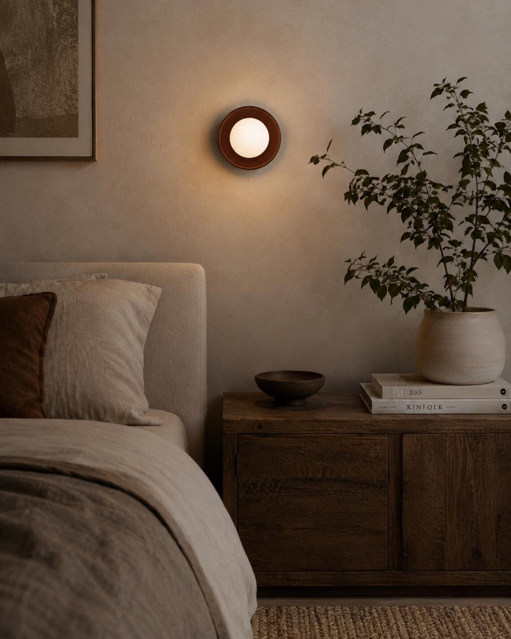 The Volta ceramic wall sconce warm light detail