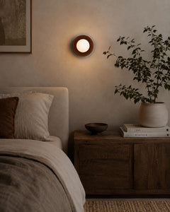 The Volta ceramic wall sconce warm light detail