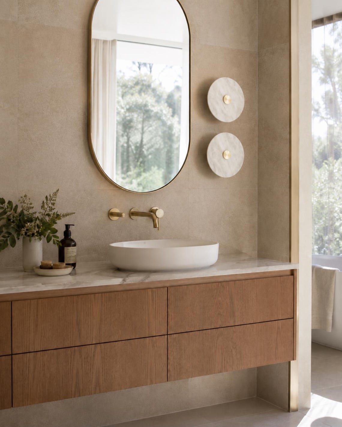 The Alba alabaster disc wall light lit, showing natural stone veining