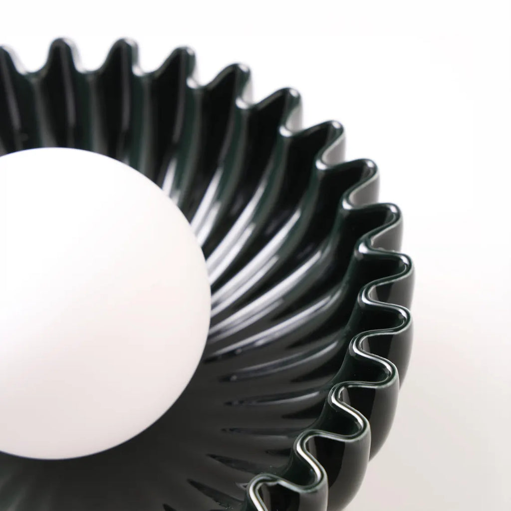 The Solara ceramic sunburst wall sconce petal detail